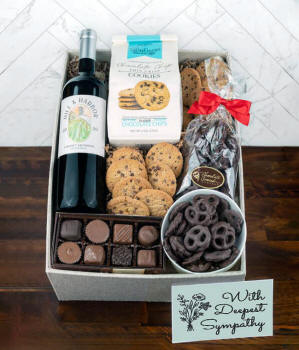 a gift box full of decadent treats with a Sympathy message card.  Contents include: a bottle of California Pinot Noir, a bag of milk chocolate pretzel, a box of mini chocolate chip cookies, and a 4-ounce box of assorted chocolates.