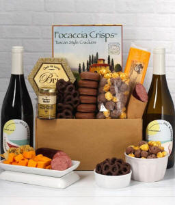 A gift set featuring two bottles of Hill &amp; Harbor wine - white and red, focaccia crisps, 2 cheeses, mustard, summer sausage, caramel popcorn, chocolate pretzels, and 6 chocolate-covered Oreos for a sweet and savory gourmet experience.